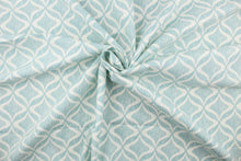 Load image into Gallery viewer, This printed fabric features a geometric design in white against thin vertical  aqua lines.  Perfect for window treatments, decorative pillows, handbags, light duty upholstery applications and almost any craft project.  This fabric has a soft workable feel yet is stable and durable.
