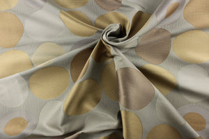 Geometric pattern of circles and ovals in gray, khaki and gold