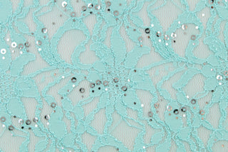 This stretch lace features a intricate floral design with shimmering sliver sequins adding to its elegance.  It is sheer and breathable with a nice soft drape.  Uses include, apparel, dancewear, costumes, curtains and home decor.