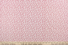 Load image into Gallery viewer, This fabric features a tiny floral design in red set against a white background.
