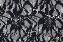 Load image into Gallery viewer, This stretch lace features a intricate floral design with shimmering sliver sequins adding to its elegance.  It is sheer and breathable with a nice soft drape.  Uses include, apparel, dancewear, costumes, curtains and home decor.
