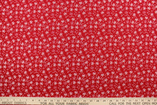 Load image into Gallery viewer, This fabric features a floral design in white set against a red background
