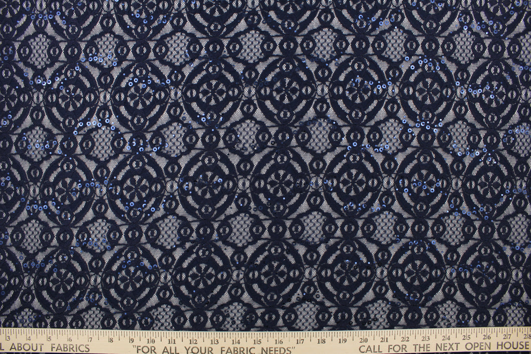 This stretch lace features a intricate medallion design in navy blue with shimmering sequins adding to its elegance.  It is sheer and breathable with a nice soft drape.  Uses include, apparel, dancewear, costumes, curtains and home decor.