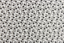 Load image into Gallery viewer,  This fabric features a tiny floral design in black set against a white background.
