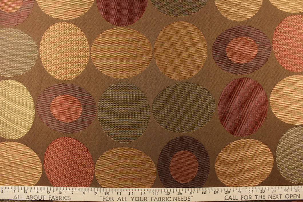  Stylish, modern and contemporary best describe this geometric pattern of circles and ovals in gold and red or rust color on a brown background. 