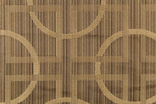 Load image into Gallery viewer, Fortran is a jacquard fabric featuring a large scale geometrical design in varying shades of brown and beige.
