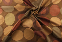 Load image into Gallery viewer, Geometric pattern of circles and ovals in gold and red or rust color on a brown background
