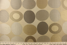 Load image into Gallery viewer, Geometric pattern of circles and ovals in gold tones on a khaki background
