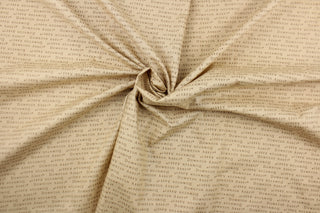 This quilting fabric features a Downton Abbey print in brown set against a  rich beige .