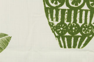 This multi use print fabric in cotton with a slub background features grass green motifs on an off-white background.  Perfect for window treatments, decorative pillows, custom cushions, bedding and light duty upholstery applications and almost any craft project.  This fabric has a soft workable feel yet is stable and durable.