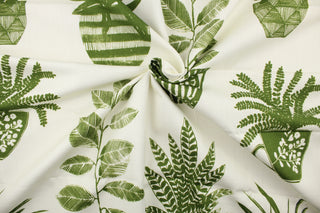 This multi use print fabric in cotton with a slub background features grass green motifs on an off-white background.  Perfect for window treatments, decorative pillows, custom cushions, bedding and light duty upholstery applications and almost any craft project.  This fabric has a soft workable feel yet is stable and durable.