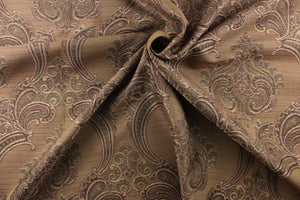 ornamental damask design in purple and green and hints of light gold tones on a brown background