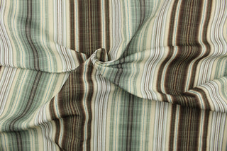 This multi use print fabric features a line design in the colors of shades of green, brown and light beige.  It is perfect for window treatments, decorative pillows, custom cushions, bedding, light duty upholstery applications and almost any craft project.  This fabric has a soft workable feel yet is stable and durable.