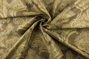 ornamental damask design in green and gray and hints of light gold on a dark gold background