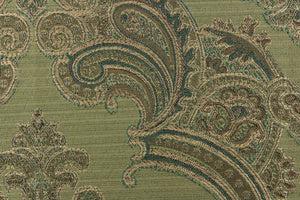 ornamental damask design in varying shades of green and hints of light gold on a green background