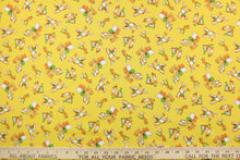 Load image into Gallery viewer, This quilting print features a cowboy and Indian design in green, white, brown, and golden yellow set against a mustard yellow background.
