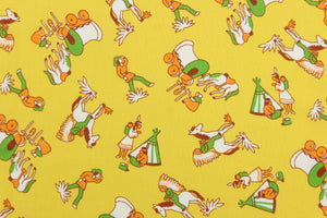 This quilting print features a cowboy and Indian design in green, white, brown, and golden yellow set against a mustard yellow background.