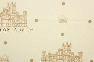  Featuring the Downton Abbey building and wording in beige and brown with brown dots against a pale beige background.  