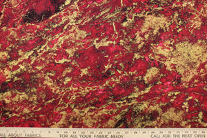  A marble design in dark red, burgundy, gold and hints of black .
