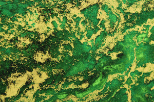 A marble design in varying shades of green and gold with hints of black . 