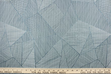 Load image into Gallery viewer,  This jacquard features a geometric design in varying shades of blue .

