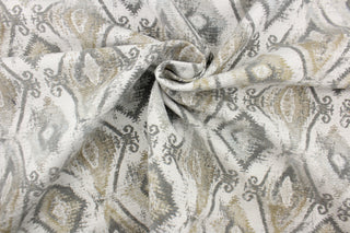 This jacquard features a diamond design in varying shades of gray and taupe . 