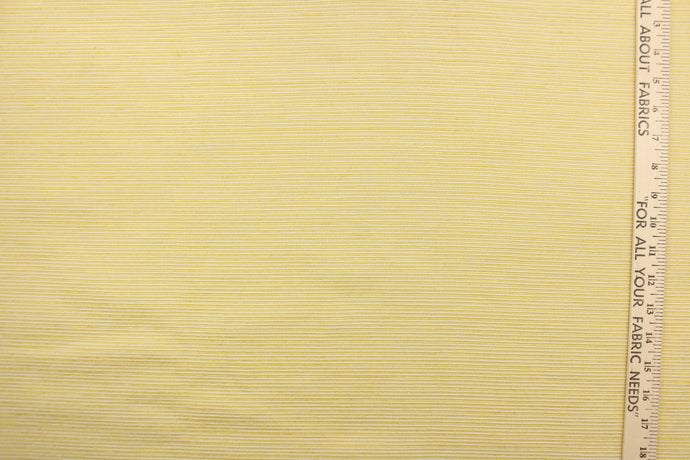 This mock linen features a stripe design in with a golden yellow with latex backing. 