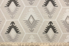 Load image into Gallery viewer, This tapestry features embroidered Aztec design in sliver, white, gray, and dark brown black set against a natural background . 
