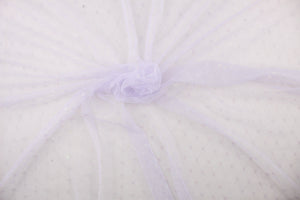 This lace features a woven floral design in a pale purple with iridescent sparkle