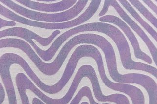This jacquard features a geometric design in slivery white and light purple . 