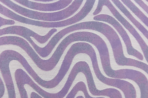 This jacquard features a geometric design in slivery white and light purple . 