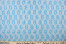 Load image into Gallery viewer,  This lace features a small woven floral design in a true blue  .
