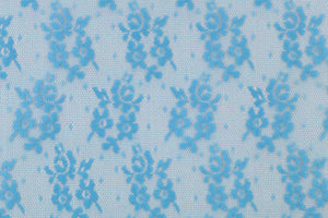  This lace features a small woven floral design in a true blue  .