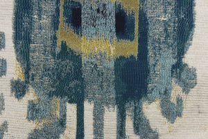 This tapestry features a unique design in blue and gold set against a slivery white . 