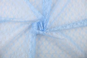 This lace features a woven floral design in a light blue .