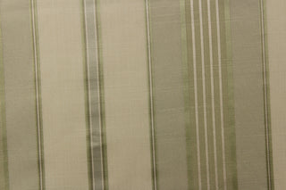 Striped pattern in colors of light green, cream and champagne