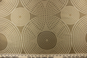 Geometric multi-layer, circular pattern in tone on tone colors in taupe, khaki, beige and gold tones