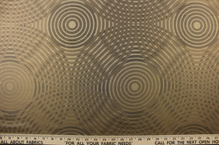 Geometric multi-layer, circular pattern in tone on tone colors in khaki, beige, black and gold tones