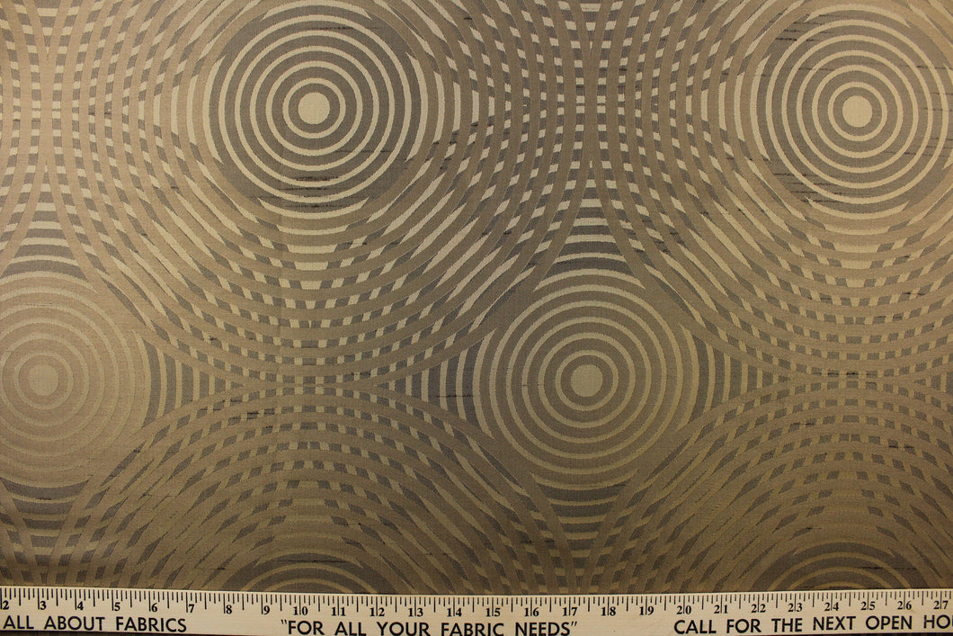 Geometric multi-layer, circular pattern in tone on tone colors in khaki, beige, black and gold tones
