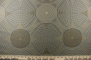 Geometric multi-layer, circular pattern in tone on tone colors in khaki, beige and blue  tones