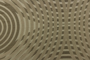 Geometric multi-layer, circular pattern in tone on tone colors in light beige, light khaki, taupe and light gold tones