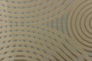 Geometric multi-layer, circular pattern in tone on tone colors in light khaki, champagne, pale blue and light gold tones