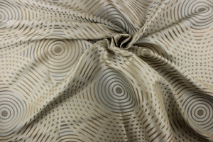 Geometric multi-layer, circular pattern in tone on tone colors in light khaki, champagne, pale blue and light gold tones