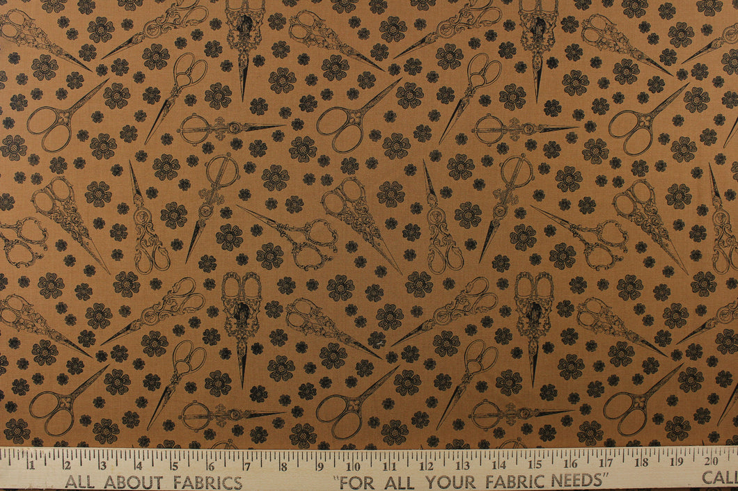 This elegant quilting print features vintage scissors in a mix of different size flowers in black on a tan background. 
