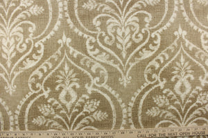  A beautiful damask design in white on a beige or khaki color with a vintage distressed look. 