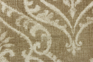  A beautiful damask design in white on a beige or khaki color with a vintage distressed look. 