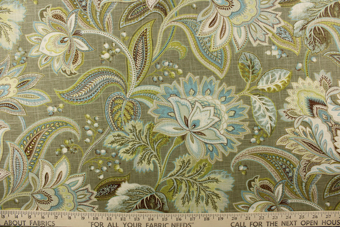 This gorgeous fabric features a large paisley design in green, brown, olive green, cream, and blue with hints of gold on brown gray background. 