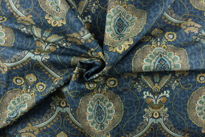 This unique fabric feature a medallion in gold tones, gray, cream and blue against a blue cheetah print. 