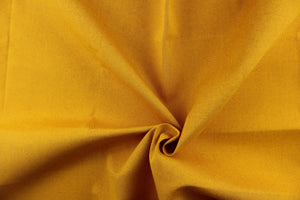 This fabric in a solid golden yellow color with red undertones is great for umbrellas, outdoor upholstery and more.