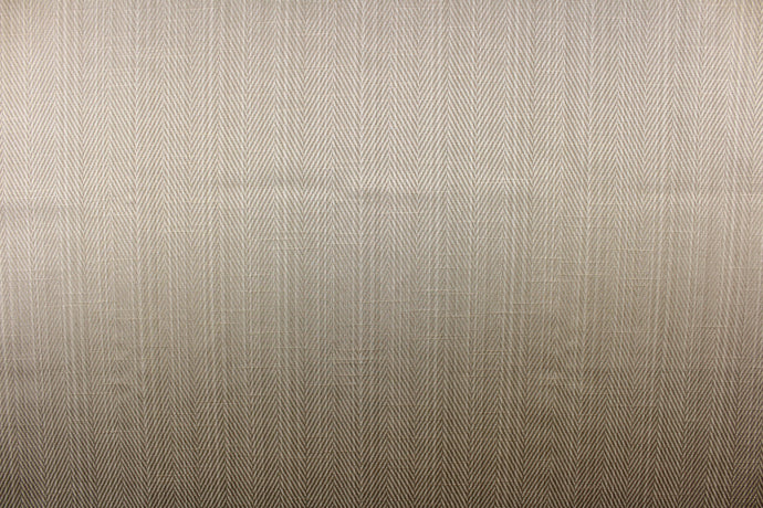 This beautiful solid platinum or champagne color fabric features a herringbone design. It also has a slight shine enhancing the look of the fabric. 